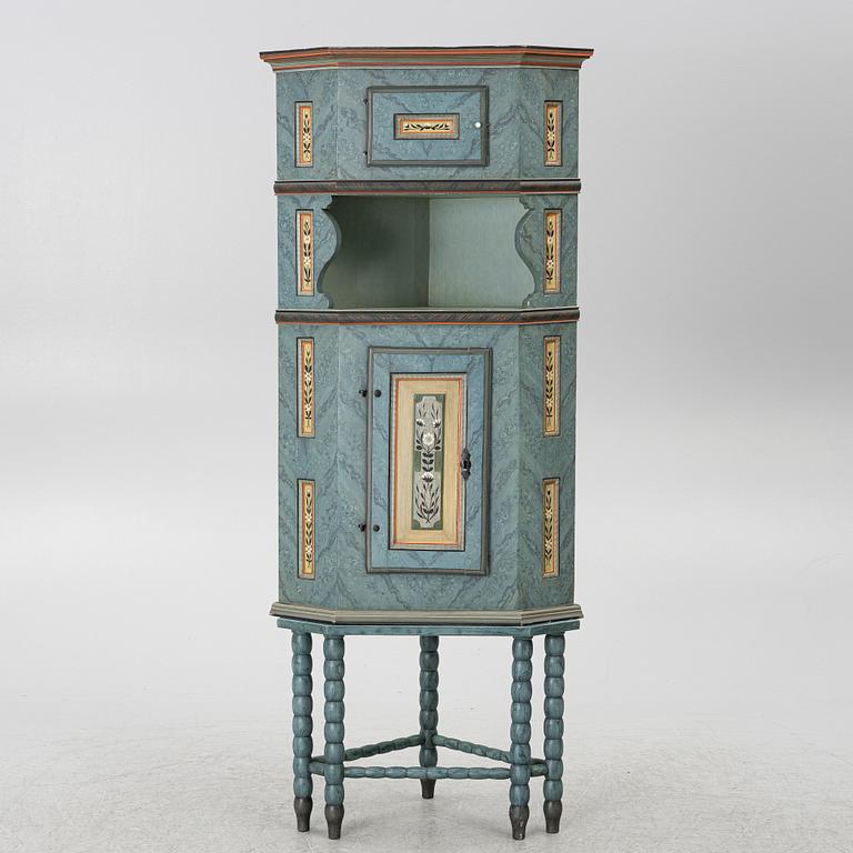 A corner cabinet, 20th century with older parts.