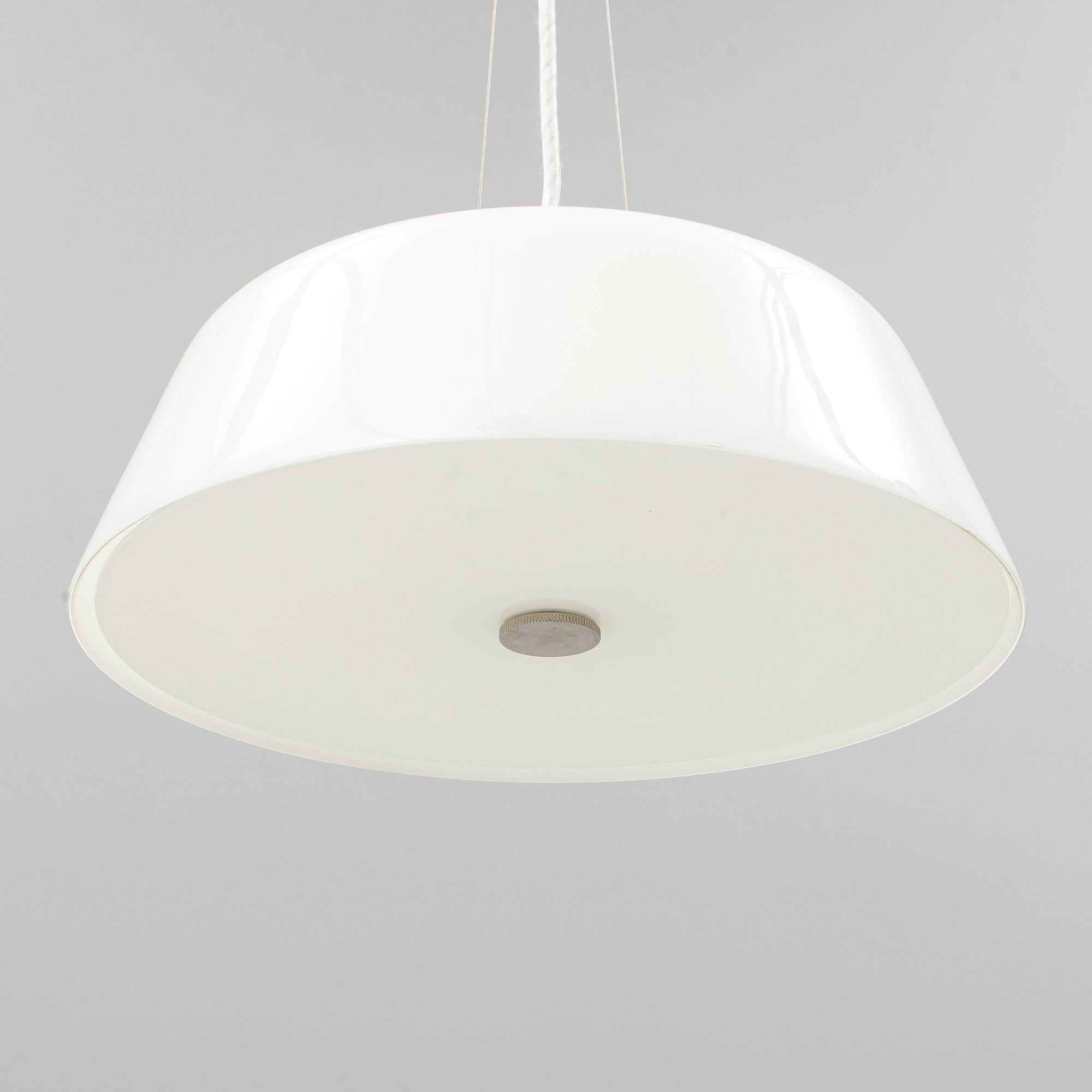 An Arne Jacobsen "Centenary Package" comprising three "Ant Chairs" and an eggshaped table, Fritz Hansen, Denmark.