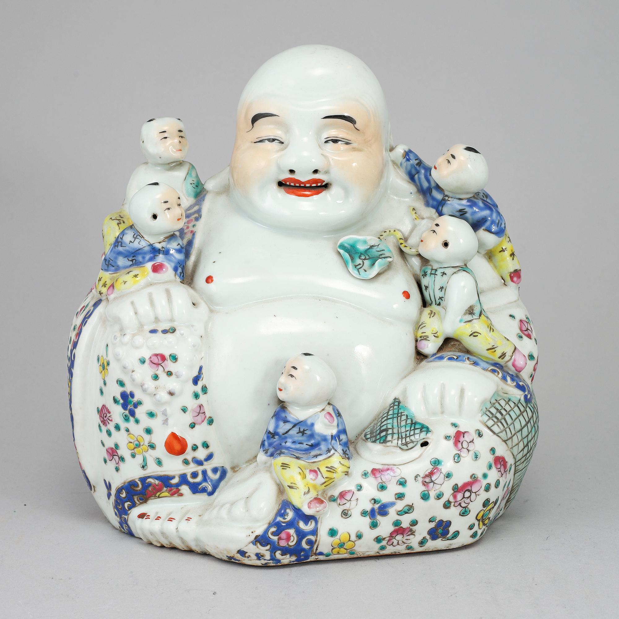 A large famille rose porcelain figure of a buddha with children, 20th century.