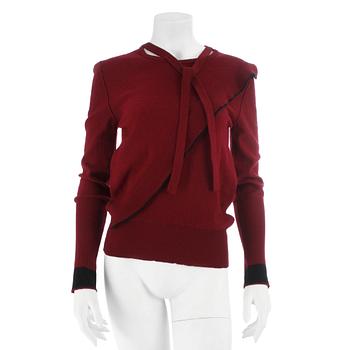 SONIA RYKIEL, a burgundy red wool sweater.