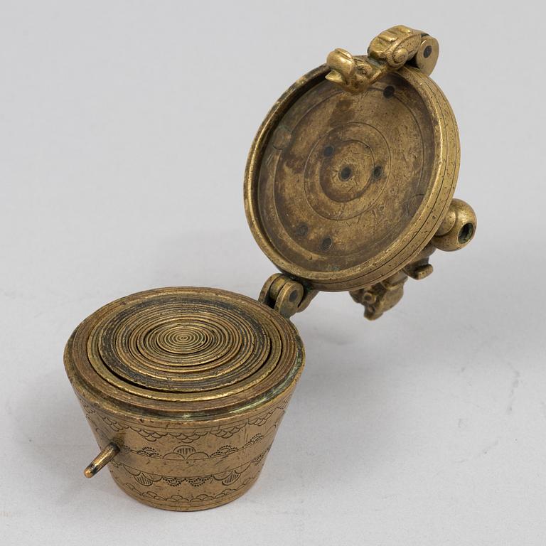A brass weight set, late 19th century.