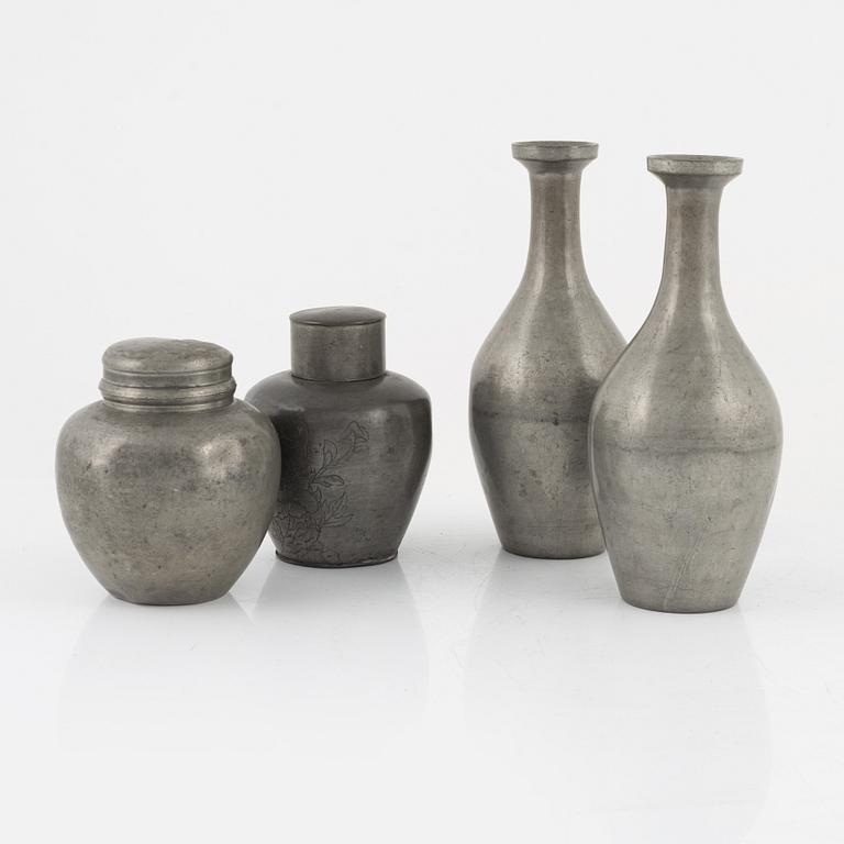 Two Japanese pewter vases and two tea caddies with covers, 20th Century.