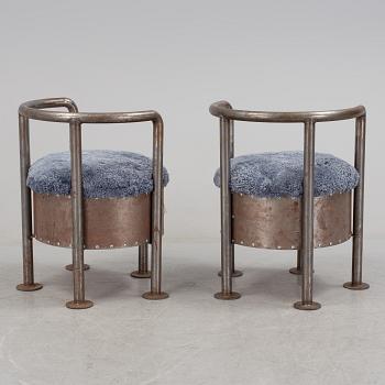 A pair of steel chairs by Arpad Földessy, 21st Century.