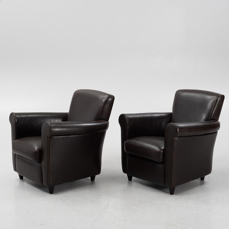 A pair of leather upholstered easy chairs, end of the 20th Century.