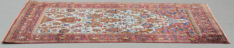 A RUG, a semi-antique silk Kashan, ca 201,5 x 122-130 cm.