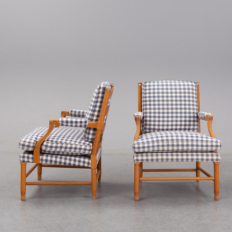 An end of the 20th Century pair of Gustavian style oak armchairs.