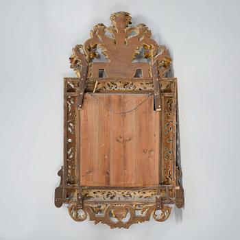 A baroque style mirror, around the year 1900.