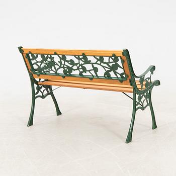 Garden sofa and parasol stand, late 20th century.