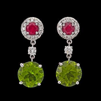 1070. A pair of ruby, diamond and peridote earrings.