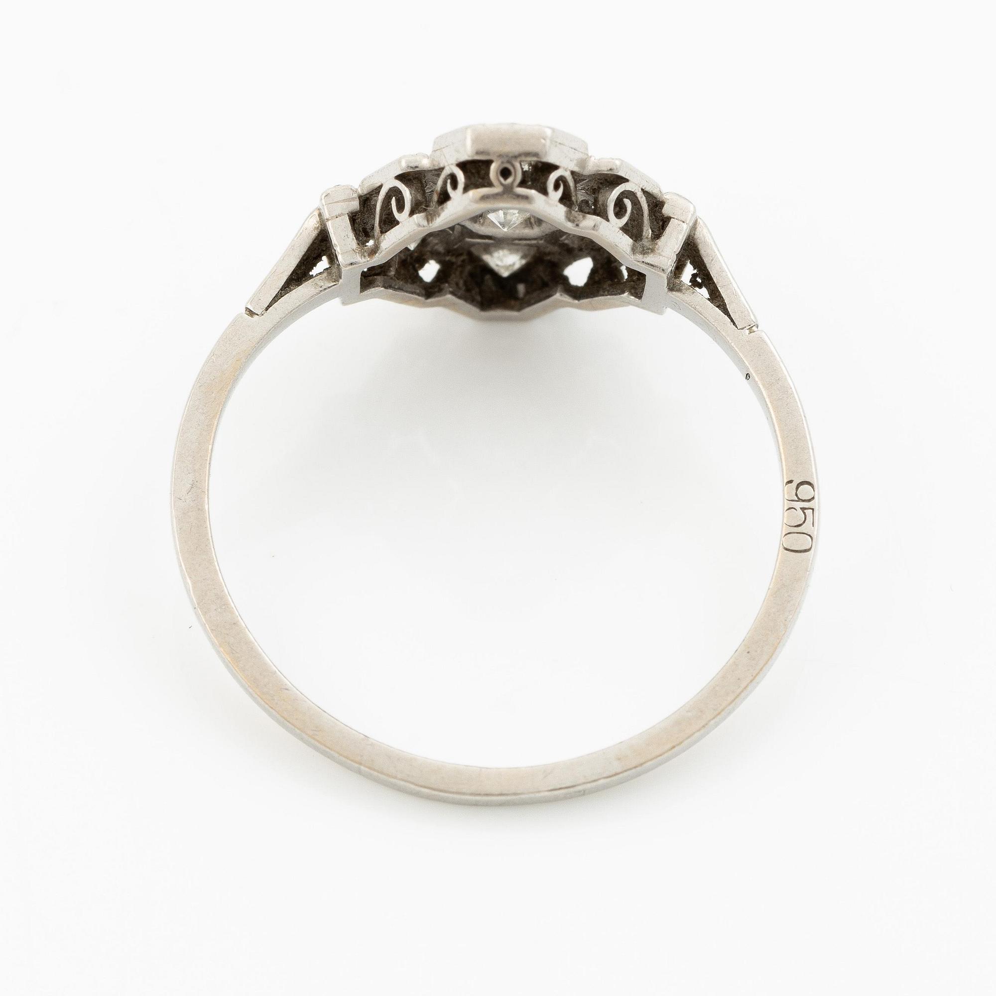 A platinum ring set with round brilliant-cut diamonds and sapphires, Art Déco.