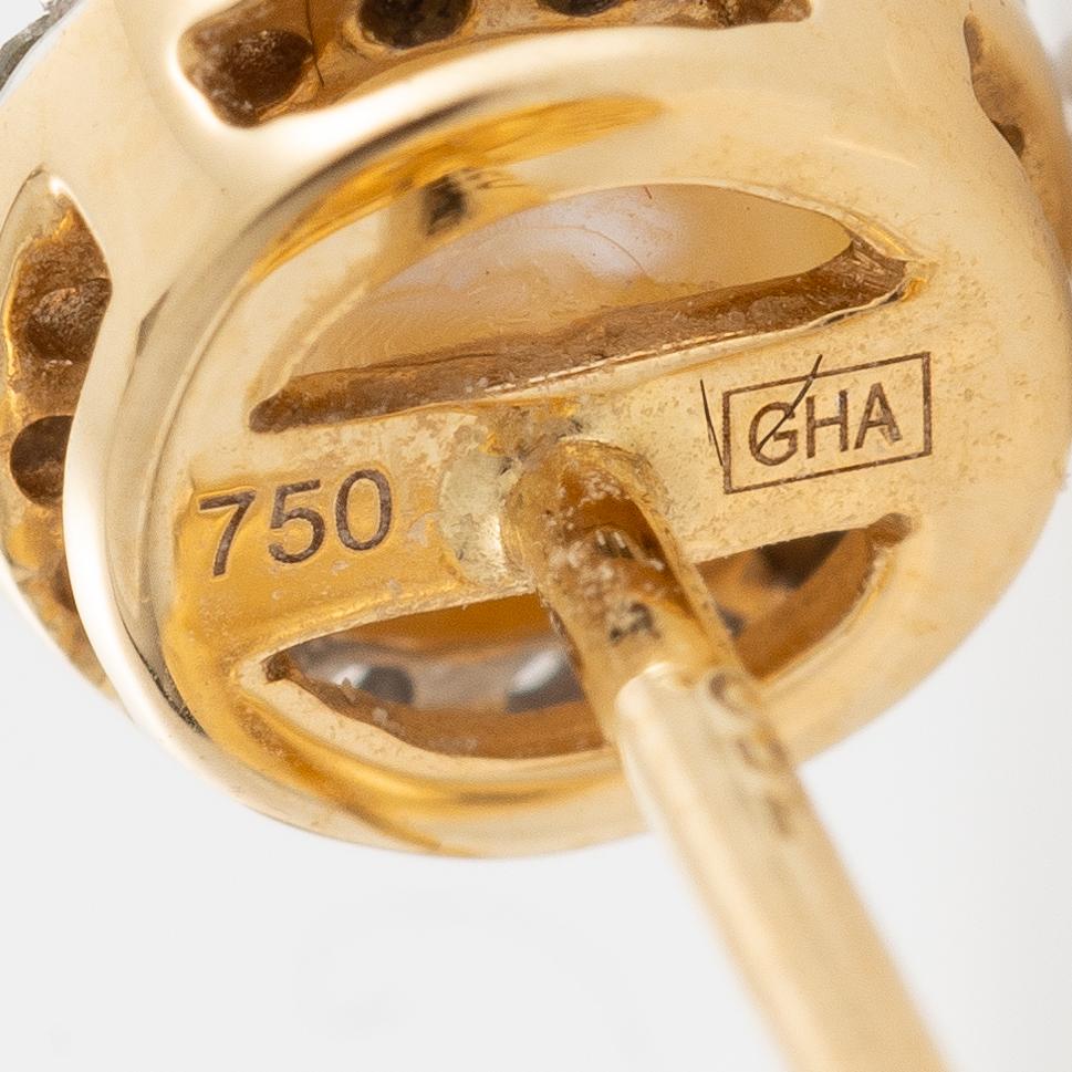 Earrings, a pair, 18K gold with pearls and small diamonds.