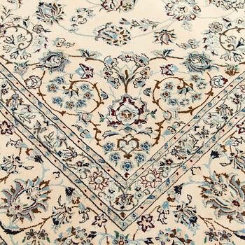A carpet, Nain, part silk s.k 9LAA. Circa 376 x 249 cm.