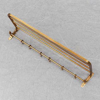 A 20th century brass cloth rack/hanger.