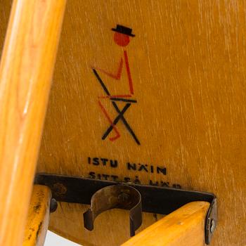 A Finnish folding chair designed for the 1952 summer Olympics in Helsinki.
