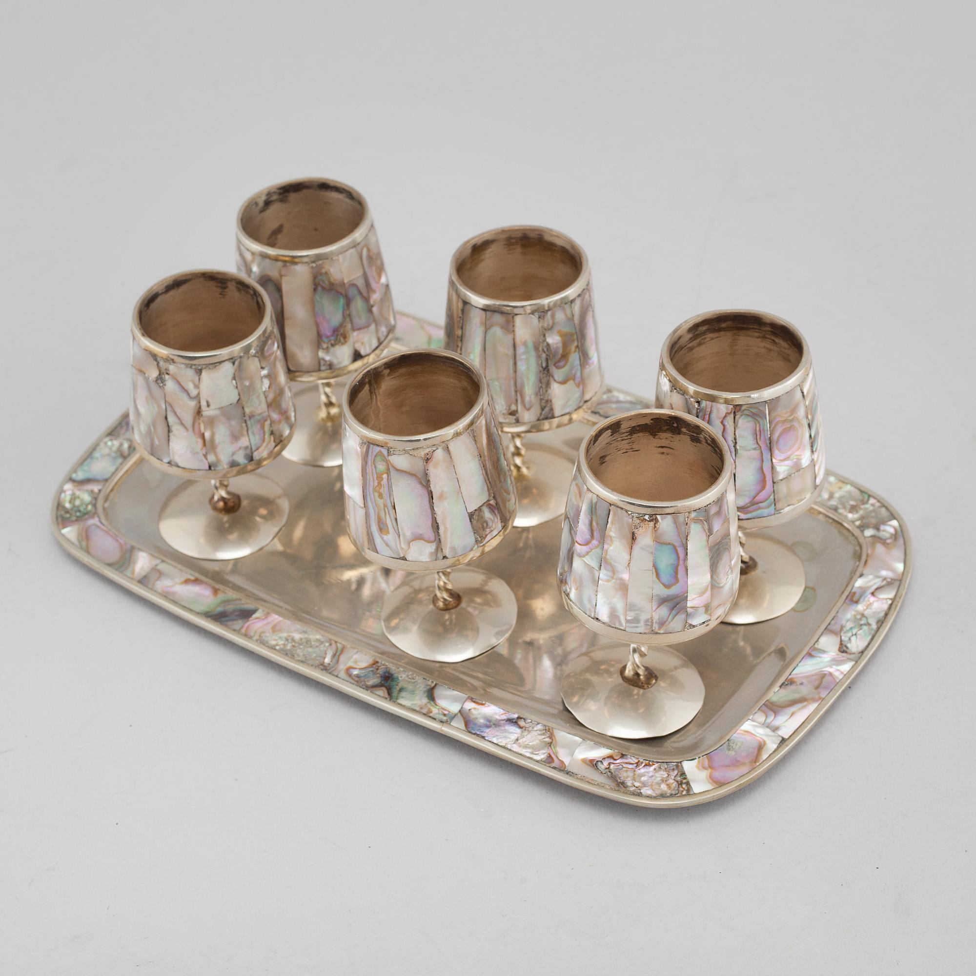 Six liqeur glasses on a tray, mother of pearl and alpaca, Mexico, second half of the 20th century.