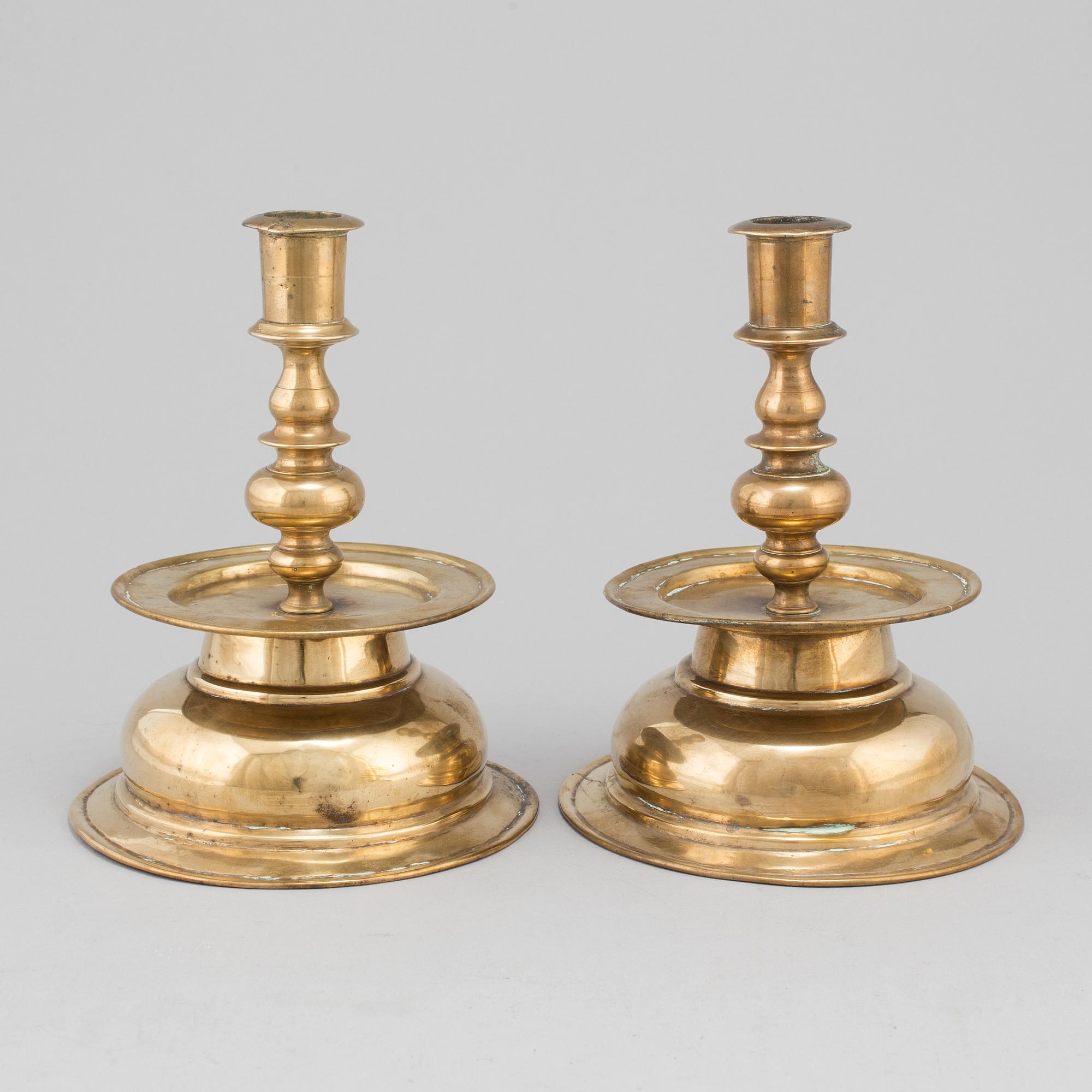 A pair of 17th century brass candlesticks.
