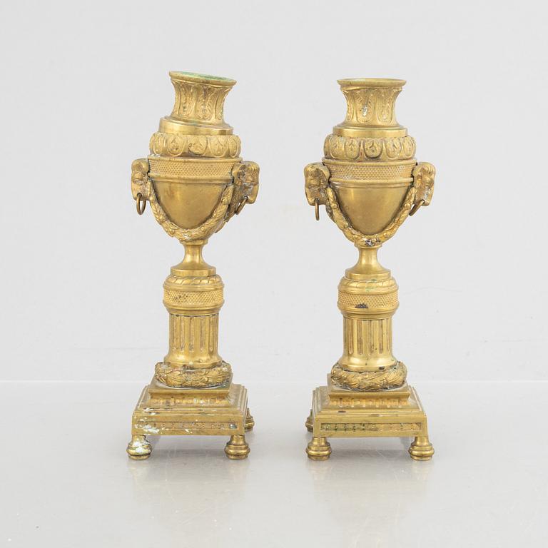 A pair of Louis XVI-style candlesticks, late 19th century.