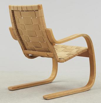 An Alvar Aalto laminated beech and webbing armchair, model 406, Svenska AB Artek, Hedemora, Sweden 1946-56.