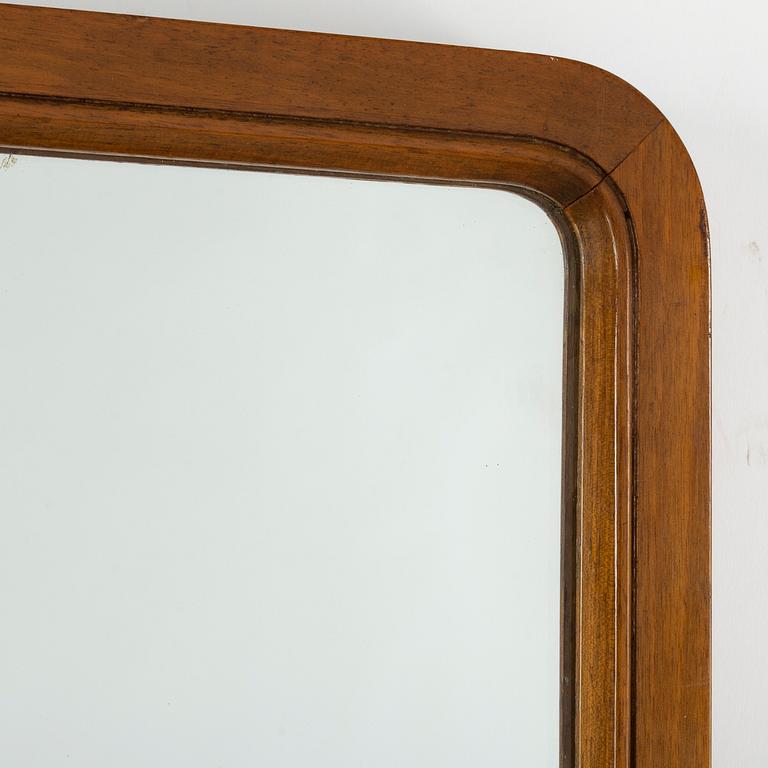 A 1940s Swedish Modern mirror.