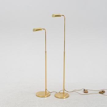 A pair of brass floor lamps, late 20th Century.