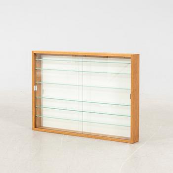 An oak display cabinet, later part of the 20th Century.