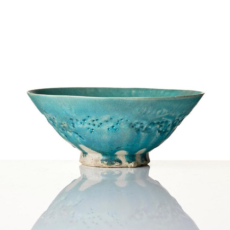 A Kashan Turquoise glazed conical pottery bowl, central Persia, 13th century.