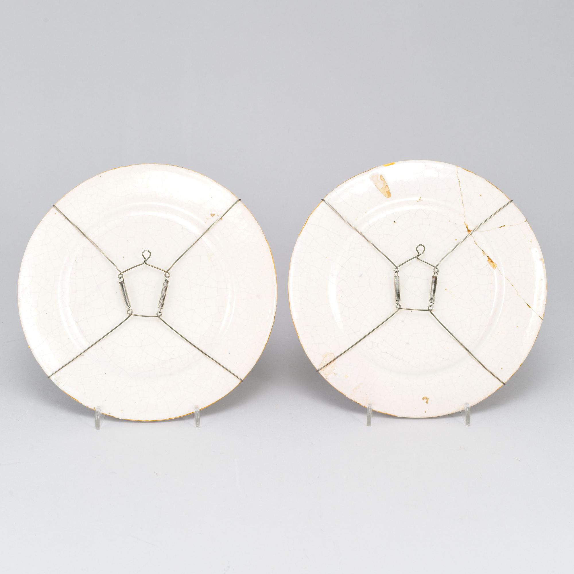 A large majolica 'istoriato' dish and two plates, 20th Century.