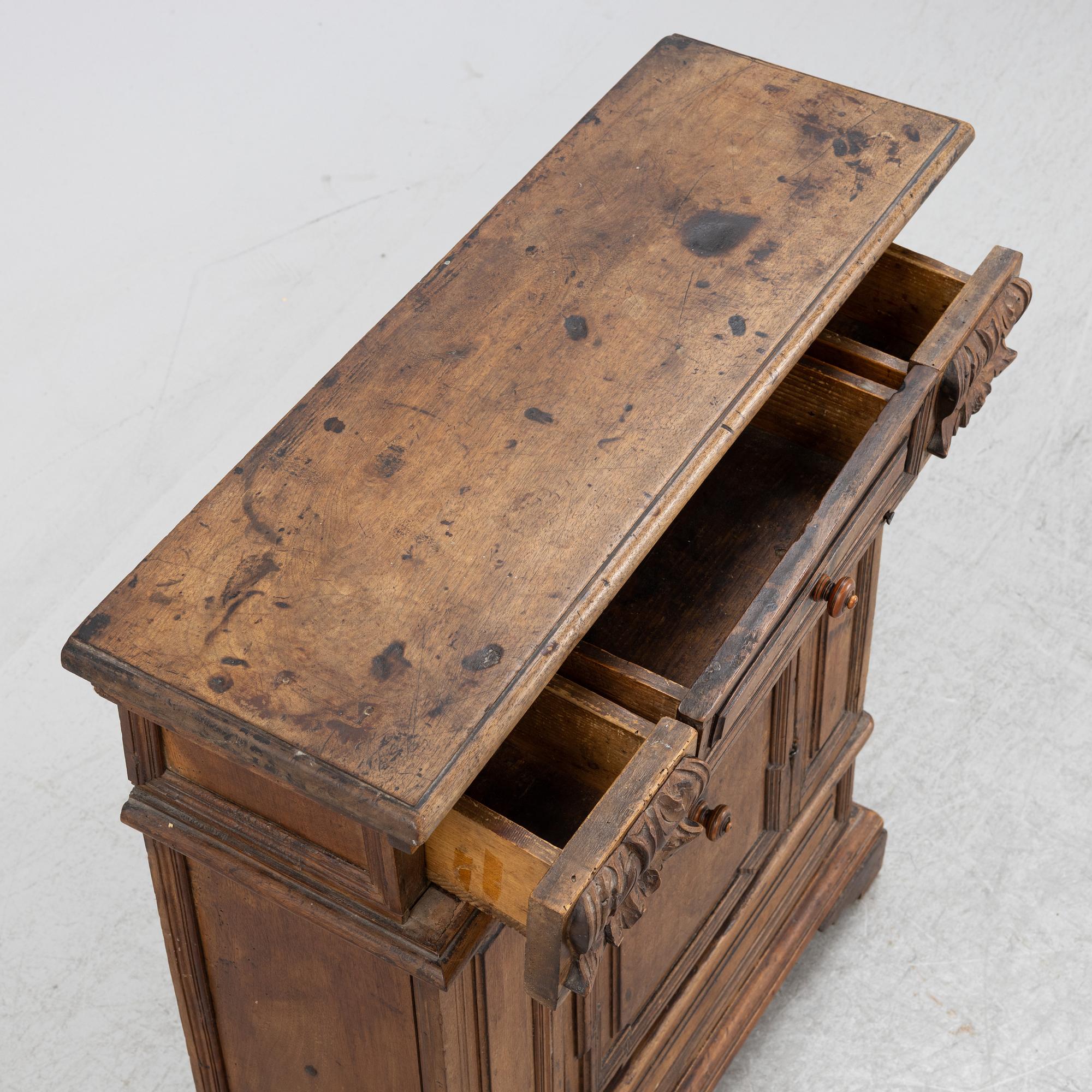 A Baroque style cabinet, circa 1900 with older parts.