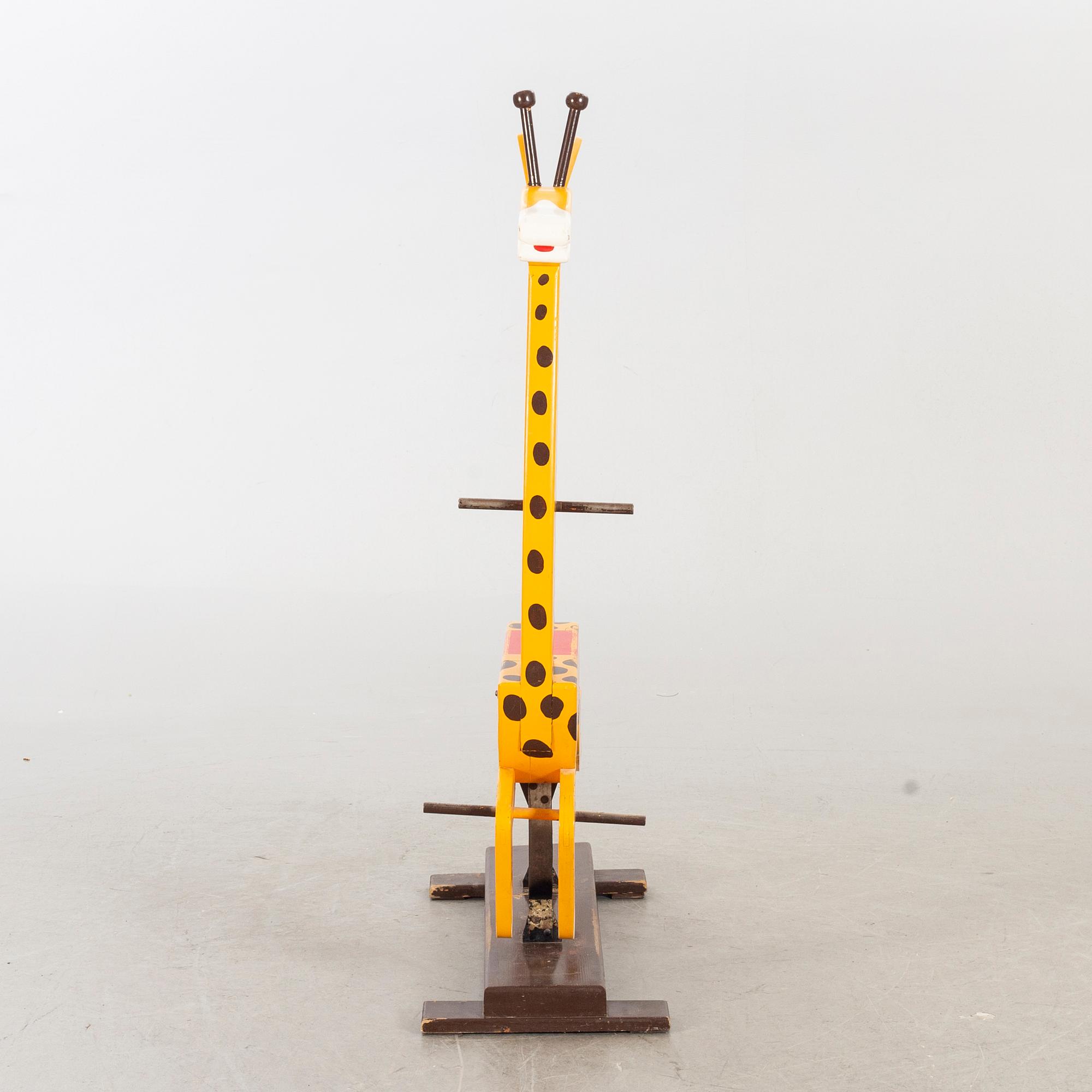 A second half of the 20th century rocking giraffe.