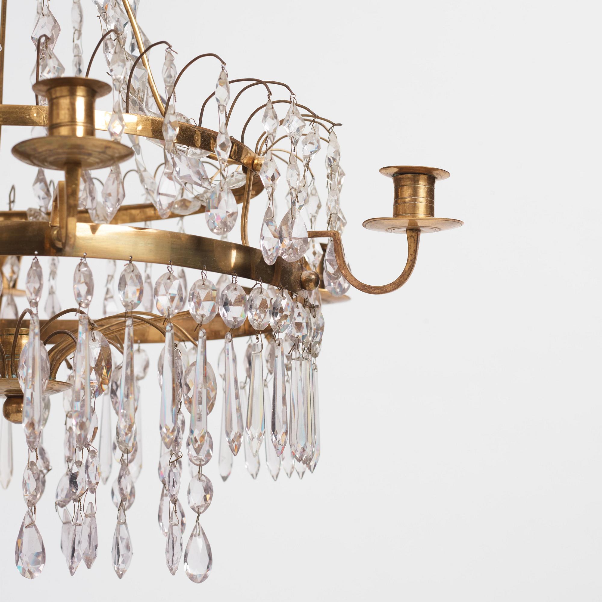 A late Gustavian gilt brass and cut glass seven-branch chandelier, Stockholm, late 18th century.