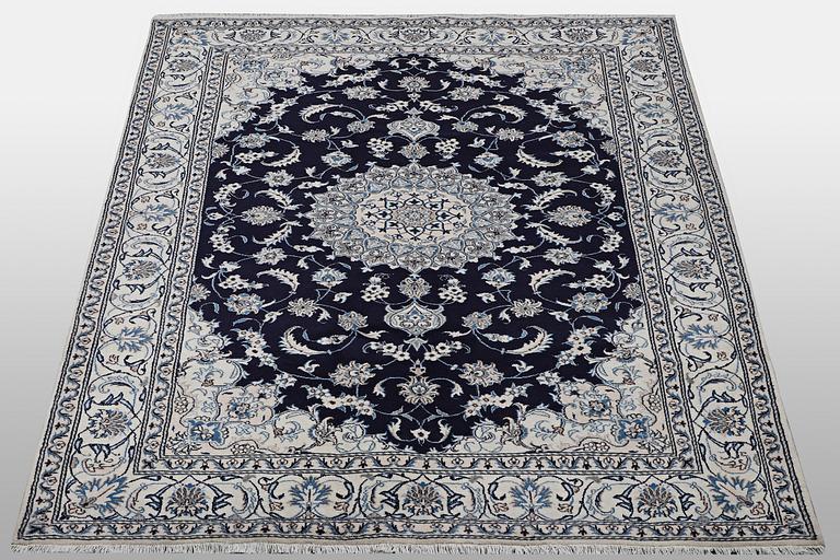 A carpet, Nain, part silk, ca 310 x 205 cm.