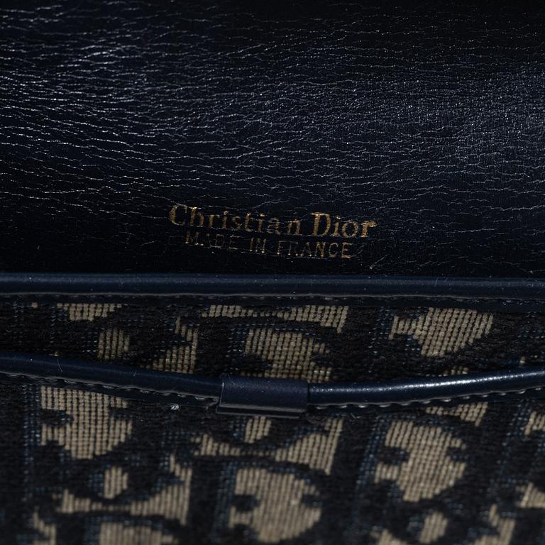 Christian Dior, a clutch and a scarf.