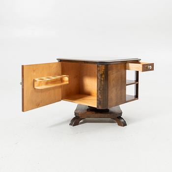 Rotating table with fitted bar, 1930s/40s.