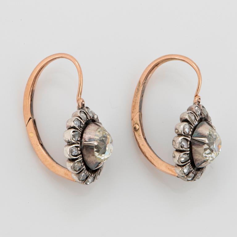 A pair of 9K gold and silver earrings set with old- and eight-cut diamonds.