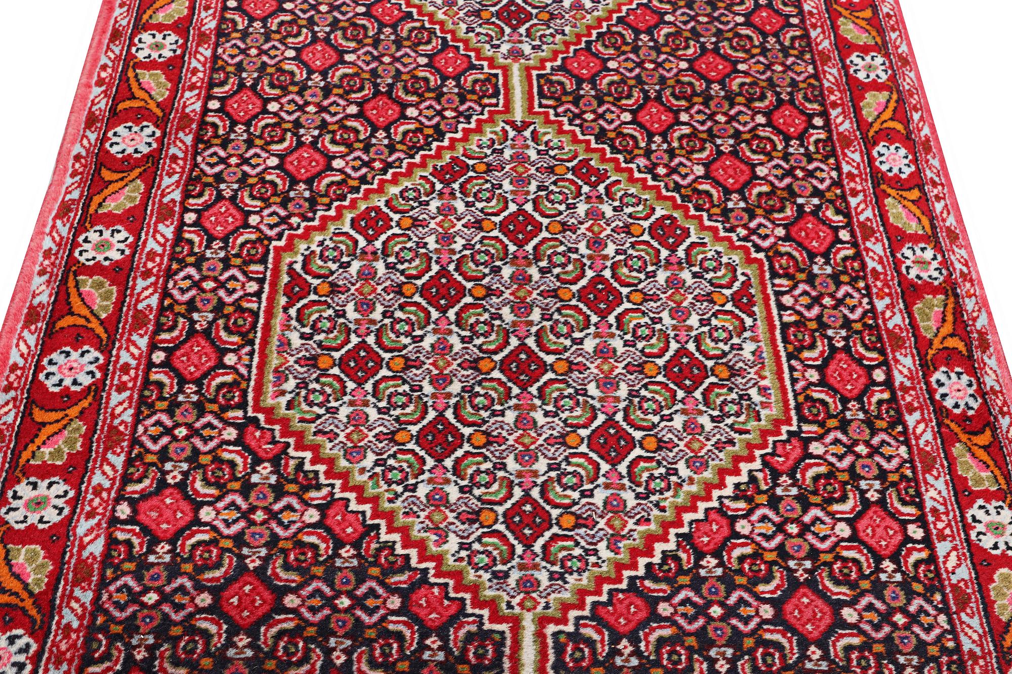 A Runner carpet, Senneh, c. 325 x 80 cm.