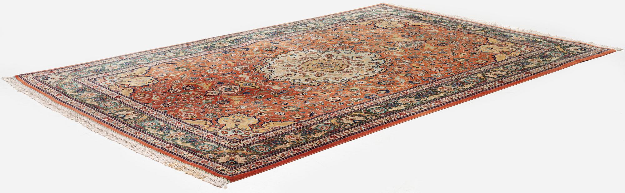 A part silk Tabriz carpet, c. 268 x 179 cm.