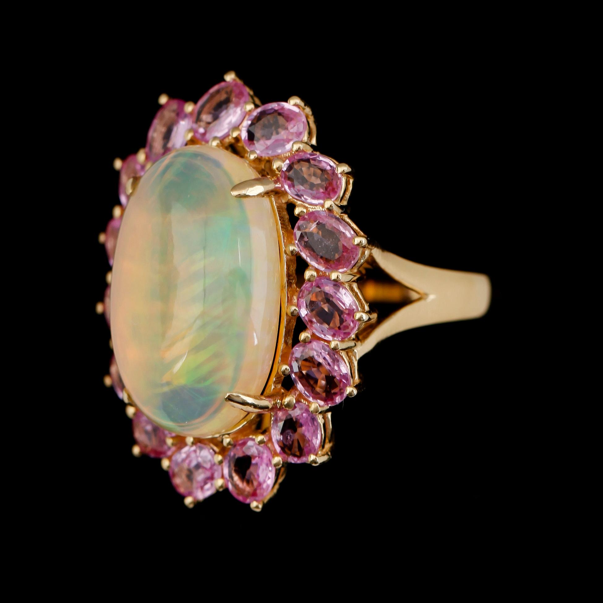 RING, 18K guld, opal och safirer.