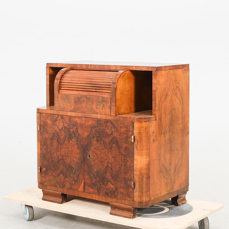 An Art Deco walnut cabinet/record player first half of the 20th century.