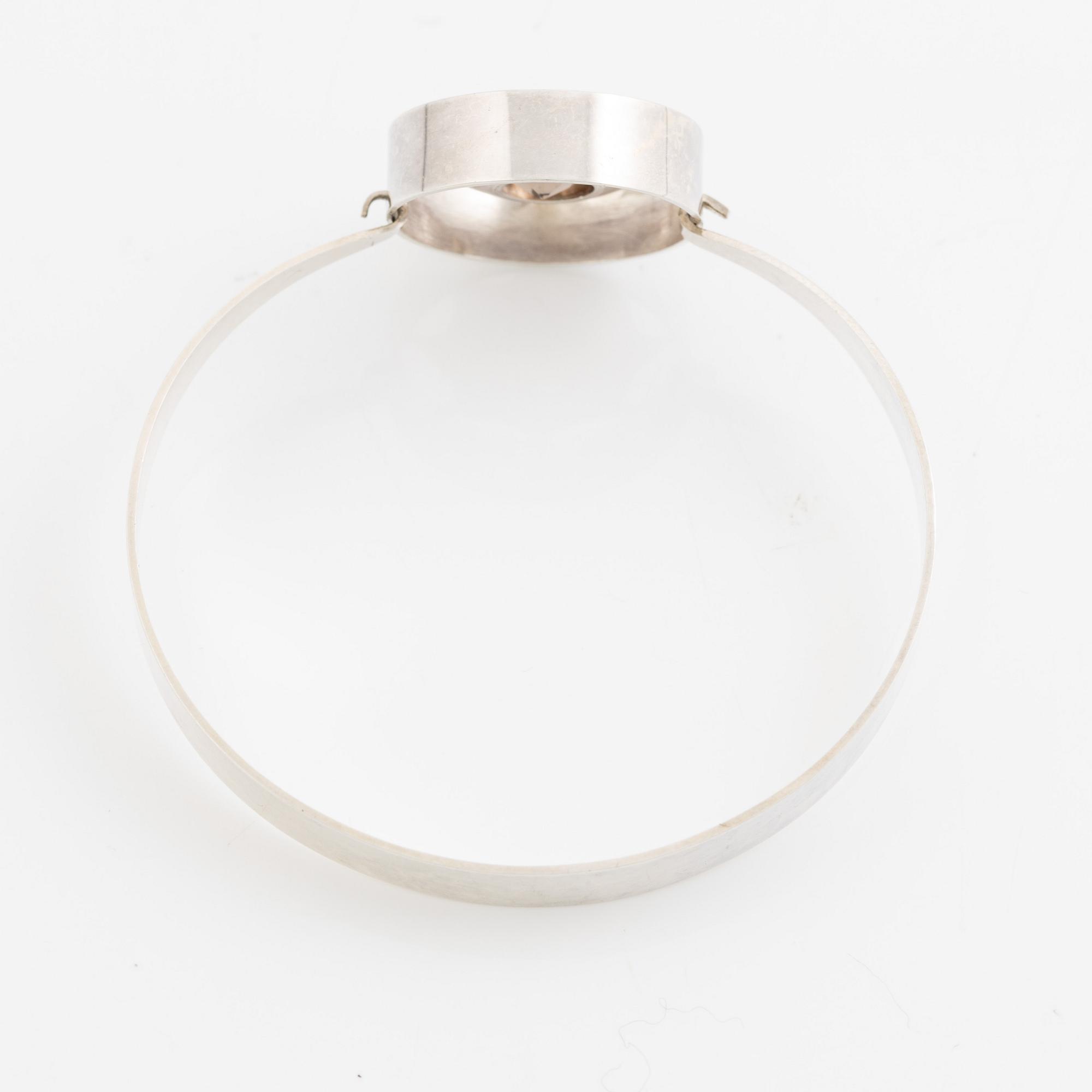 Arm ring and brooch, silver with smoky quartz, Kultasepät Salovaara.