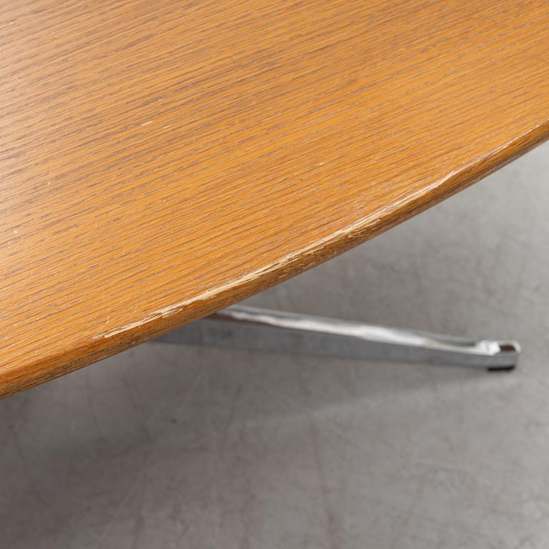 An 'Oval 96' table by Florence Knoll for Knoll International.