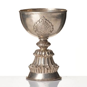 A Tibetan butter lamp, silvered copper, 20th century.