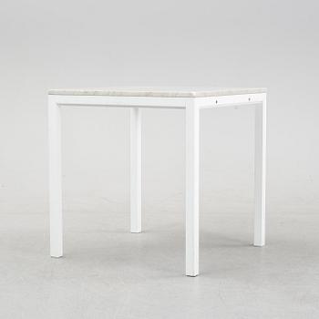 A marble top table, 21th century.