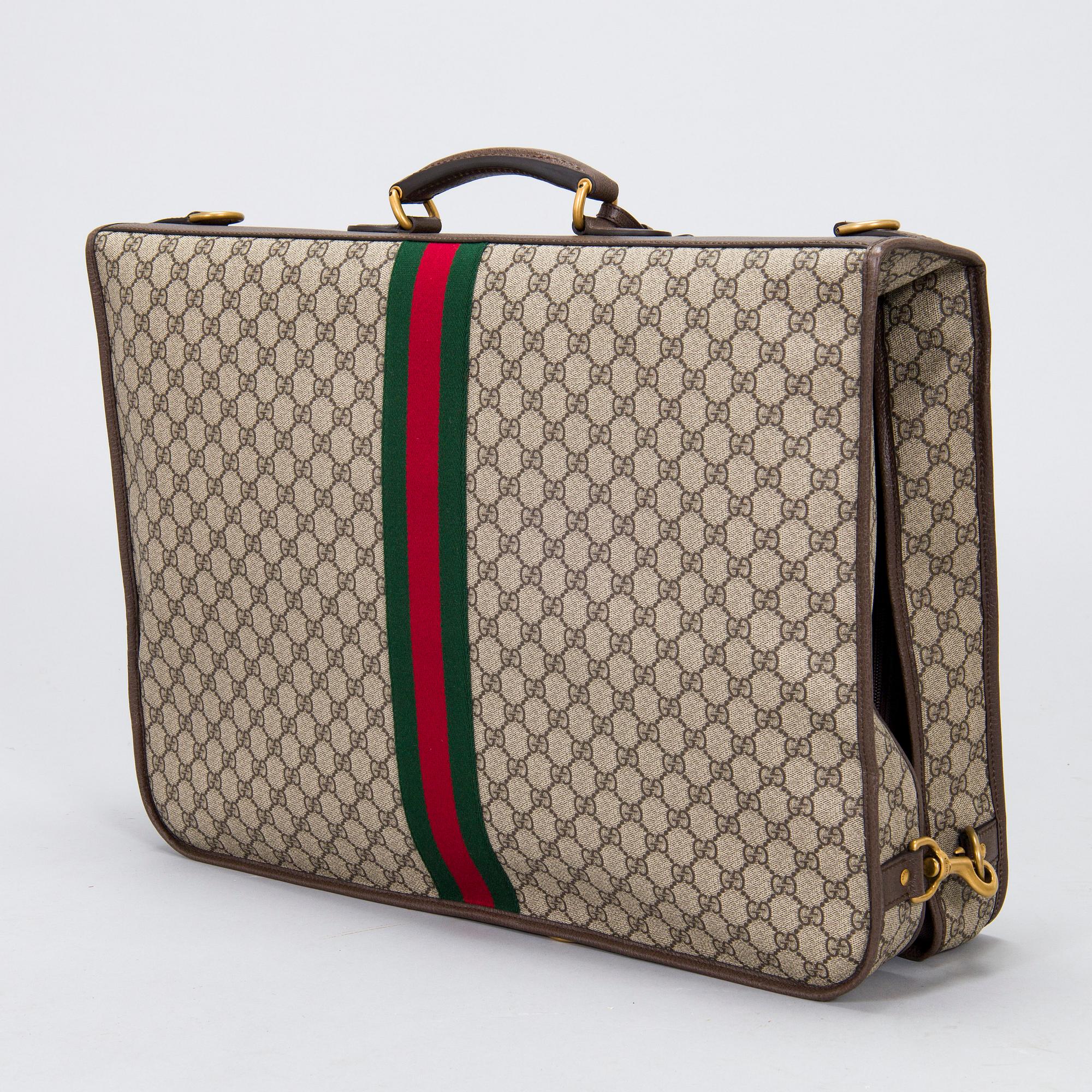 Gucci, a 'Savoy' garment bag.