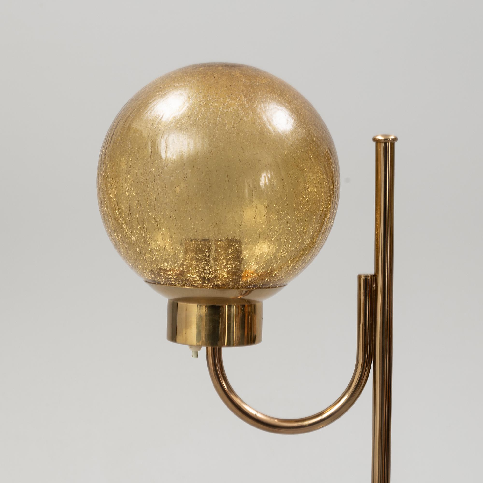 Bergboms, a pair of model 'G-118', brass and glass floor lamps. Second half of the 20th century.