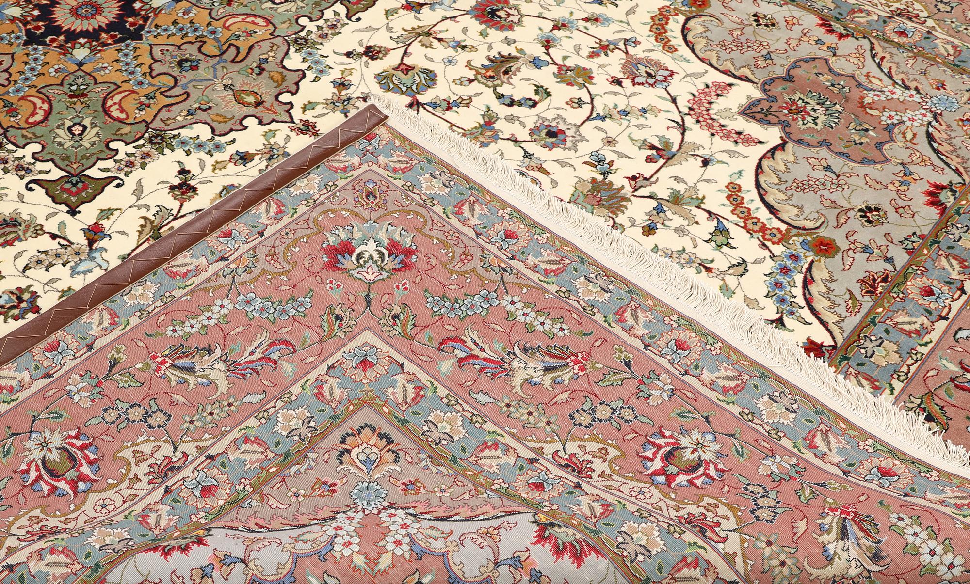 A part silk Tabriz carpet, so-called 50 Raj, approx. 356 x 250 cm.