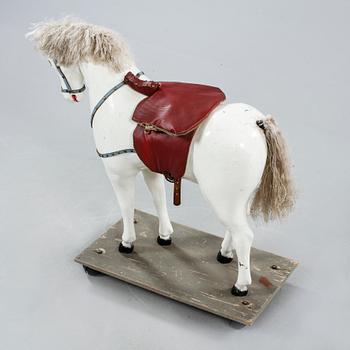 A toy horse from the first haöf of the 20th century.