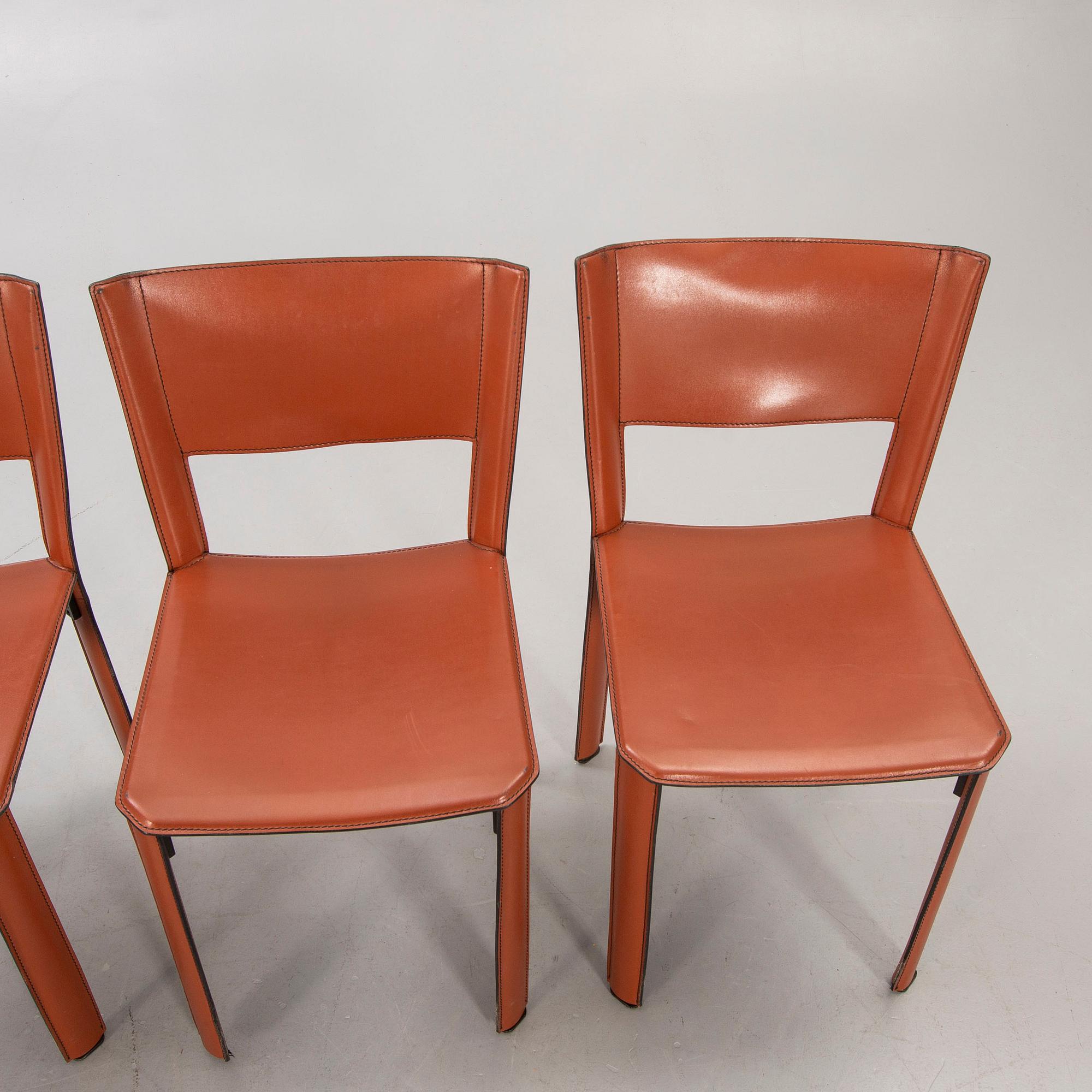 A set of four Matteo Grassi leather chairs later part of the 20th century.