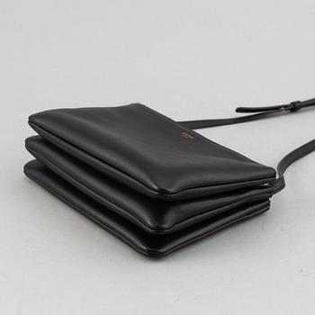 Céline, a black leather 'Trio Bag'.