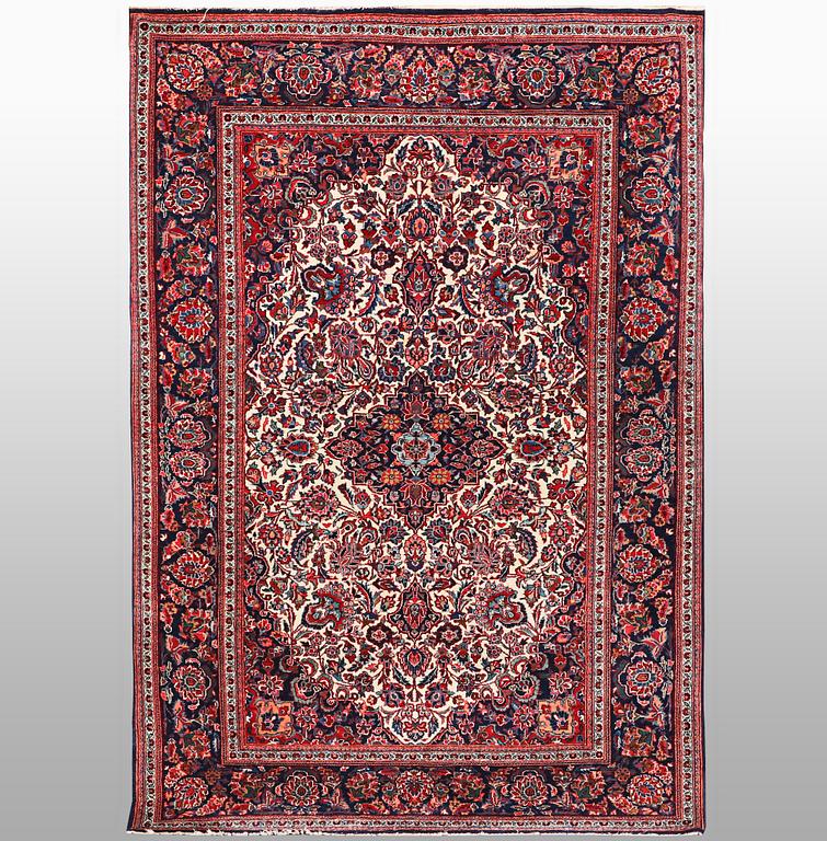 A rug, semi-antique Keshan, 217 x 134 cm.