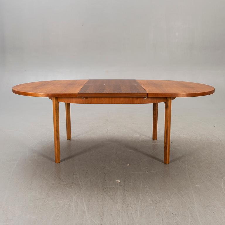 A 1960s teak dining table.